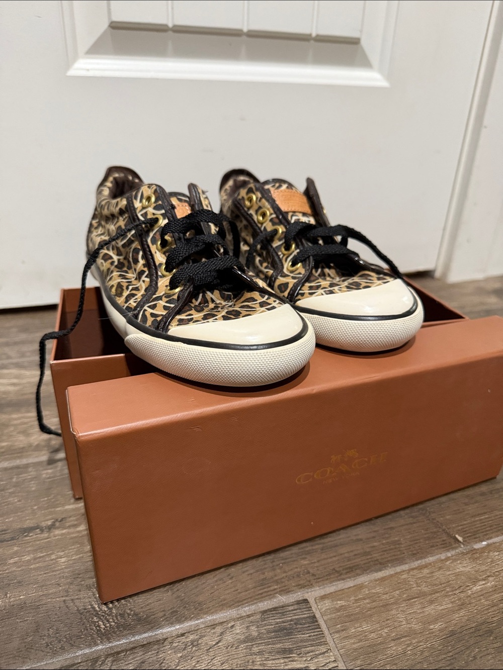 Coach women’s Leopard-Print Low-Top Sneakers in Brown and Black
